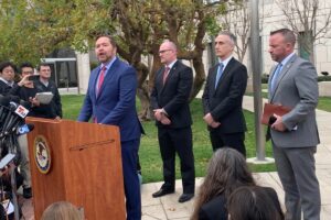 jeff-mitchell-ippei-outside-courthouse.jpg